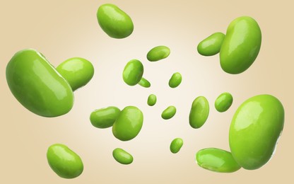 Delicious edamame soybeans falling on beige background