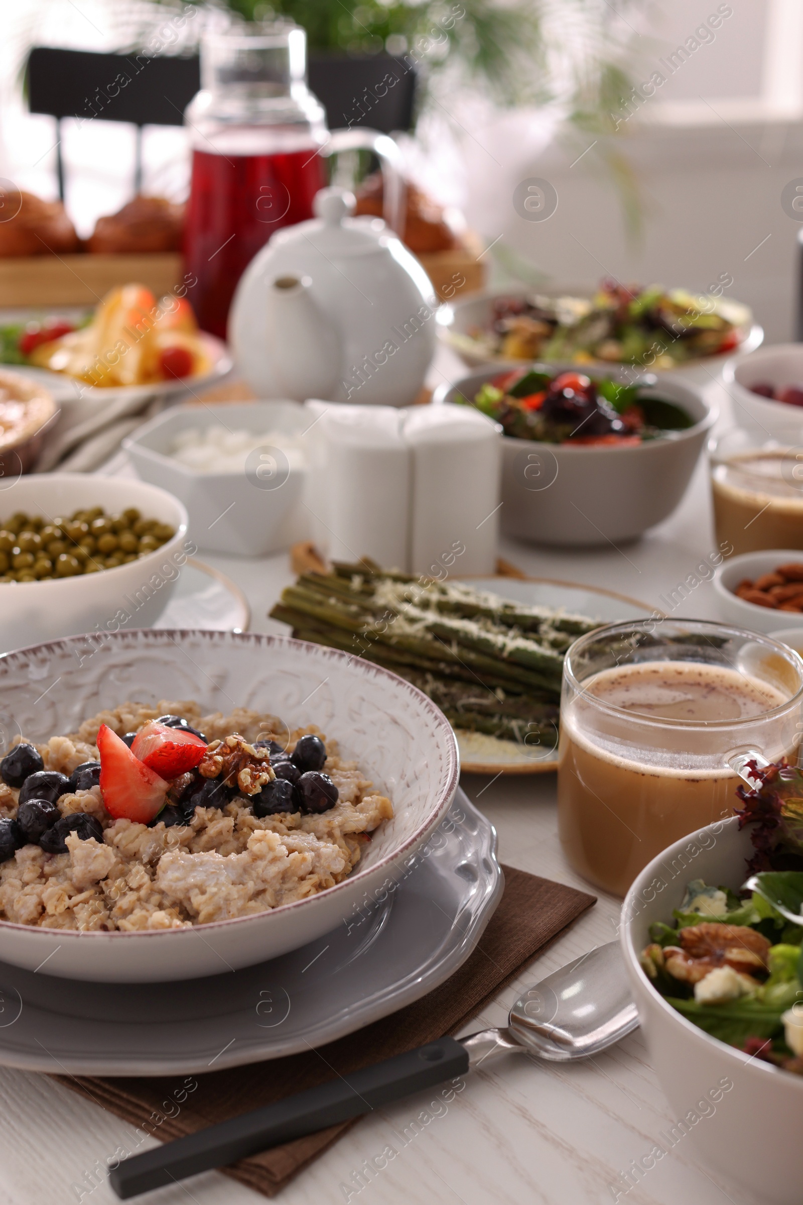 Photo of Many different dishes served on buffet table for brunch