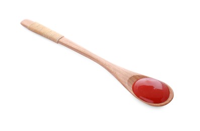 Photo of Wooden spoon with tasty fresh ketchup isolated on white