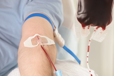 Photo of Man donating blood to save someone's life in hospital