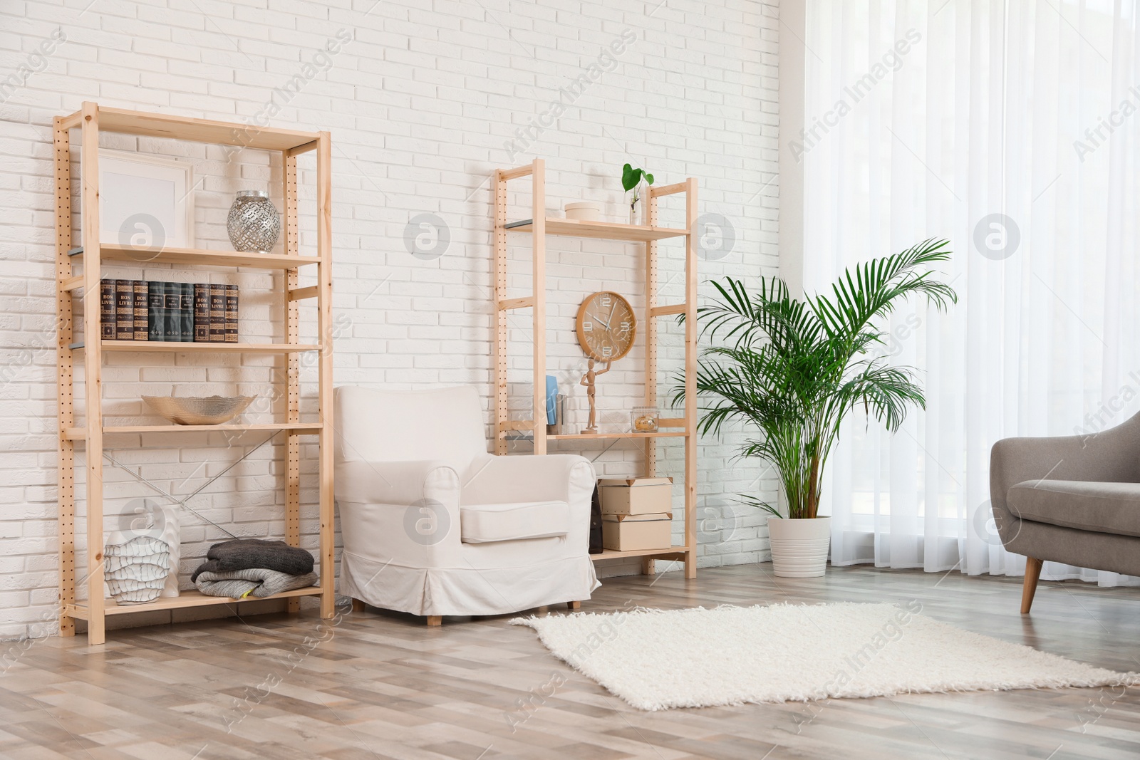 Photo of Wooden storage in stylish living room. Idea for interior design