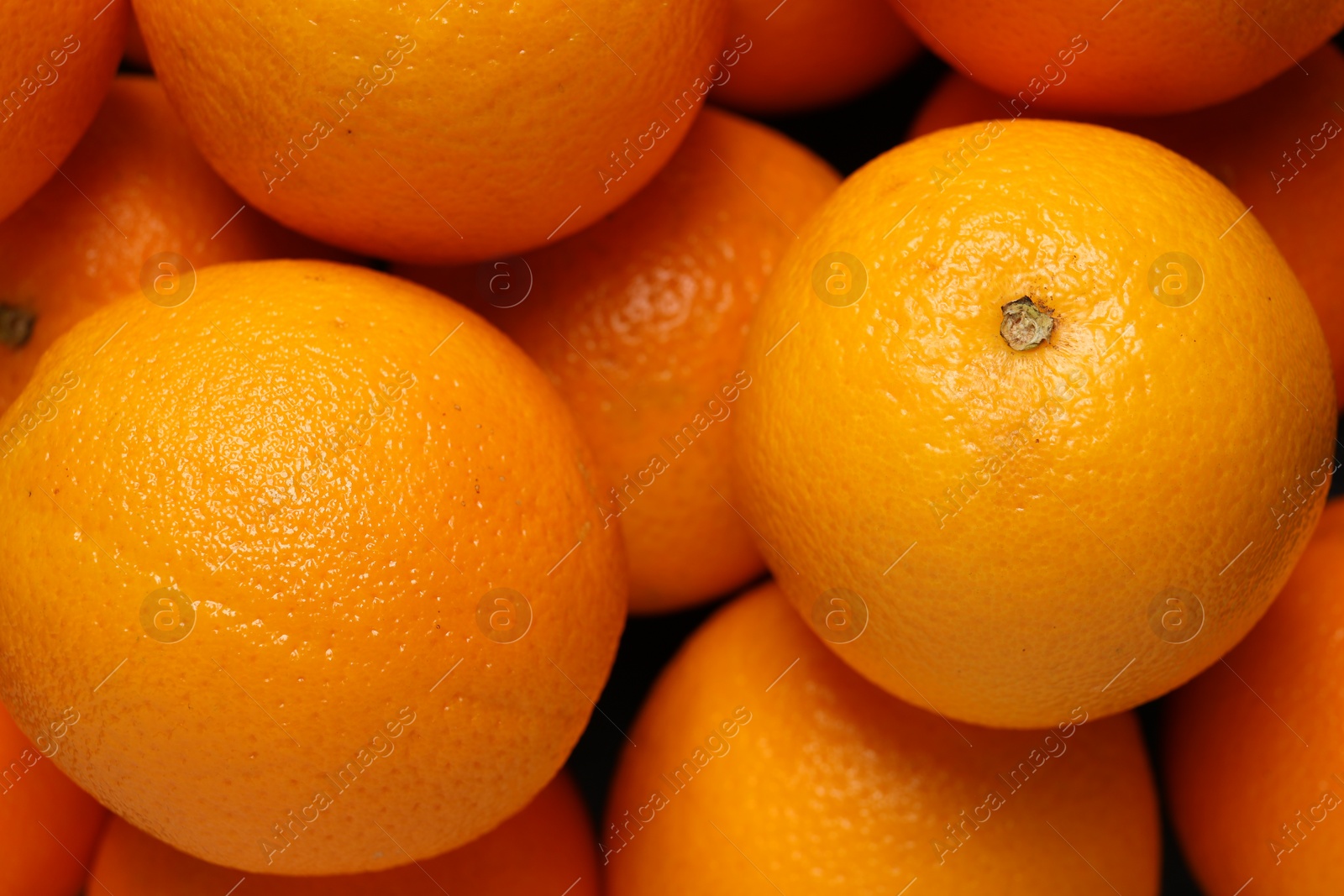 Photo of Tasty ripe fresh oranges as background, top view