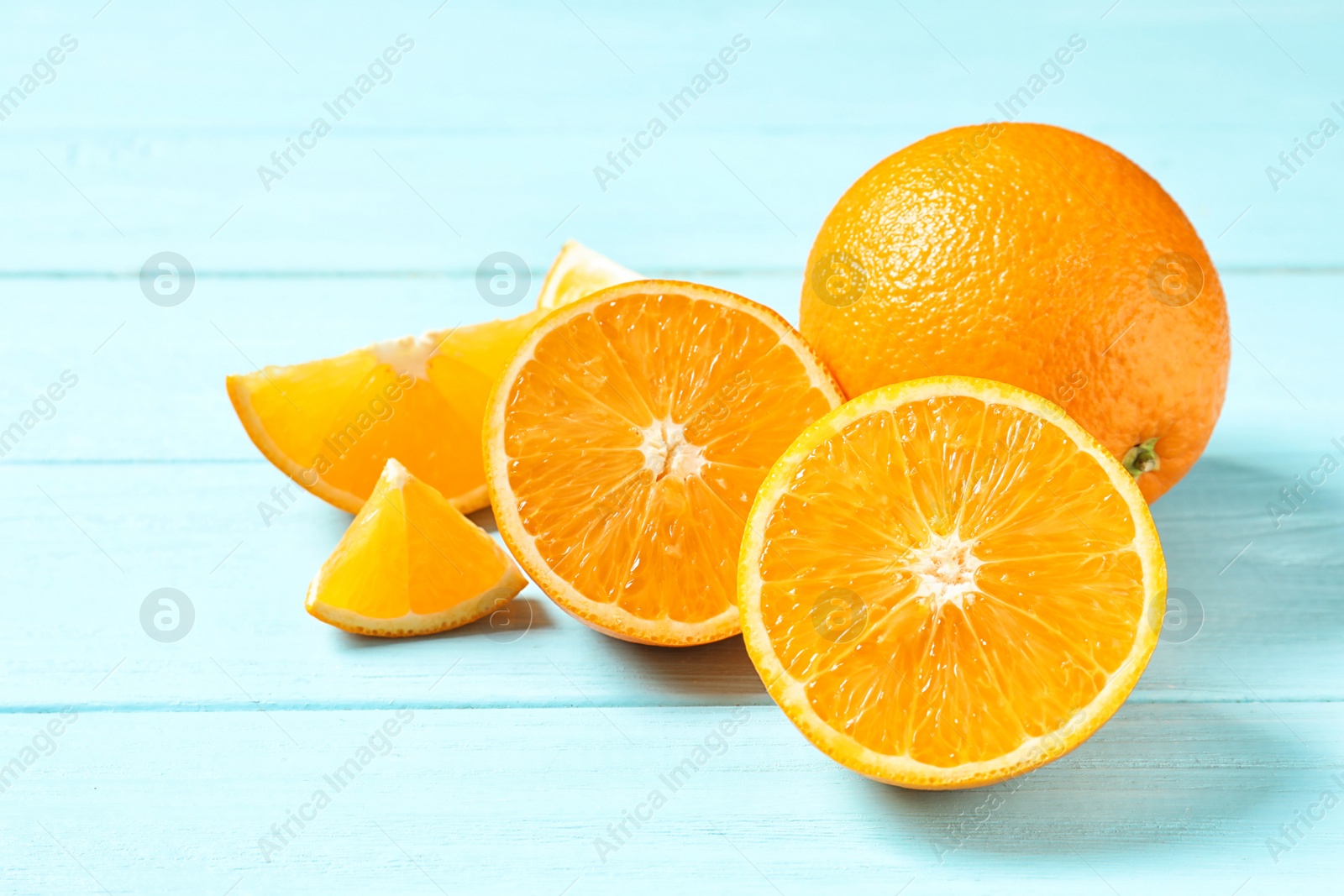 Photo of Fresh oranges on wooden background. Healthy fruits