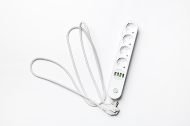 Extension cord on white background, top view. Electrician's equipment