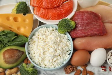 Different products rich in protein on table, closeup