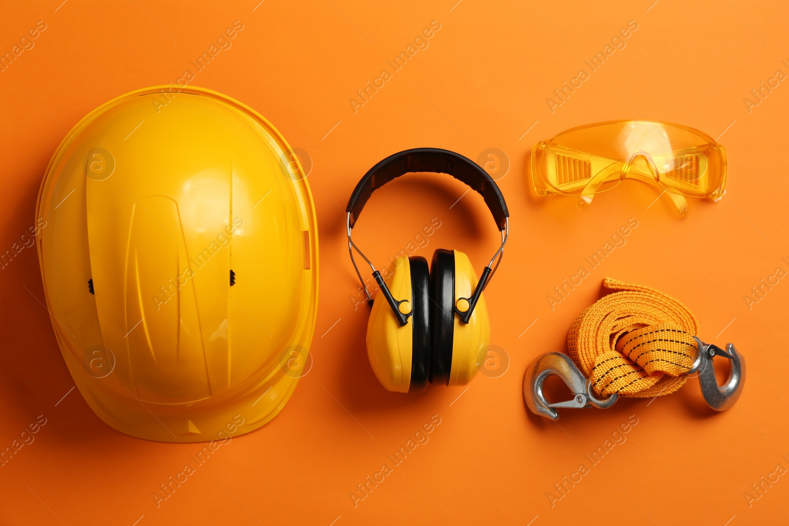 Photo of Flat lay composition with safety equipment on color background