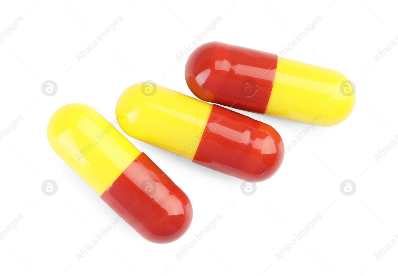 Photo of Three antibiotic pills isolated on white, top view