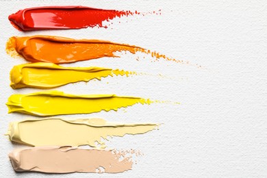 Beautiful strokes of colorful oil paints on white canvas, closeup. Space for text