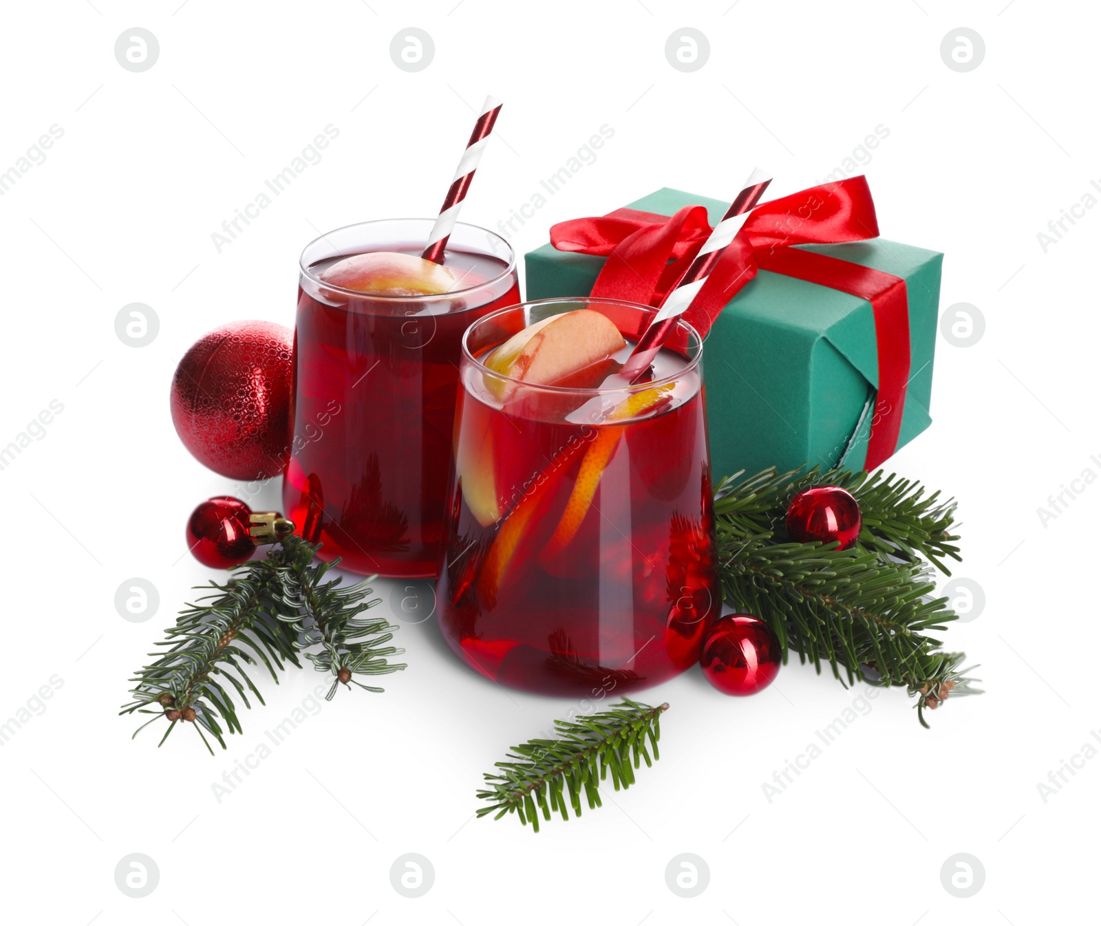 Photo of Delicious Sangria drink in glasses and Christmas decorations on white background