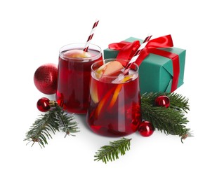Delicious Sangria drink in glasses and Christmas decorations on white background