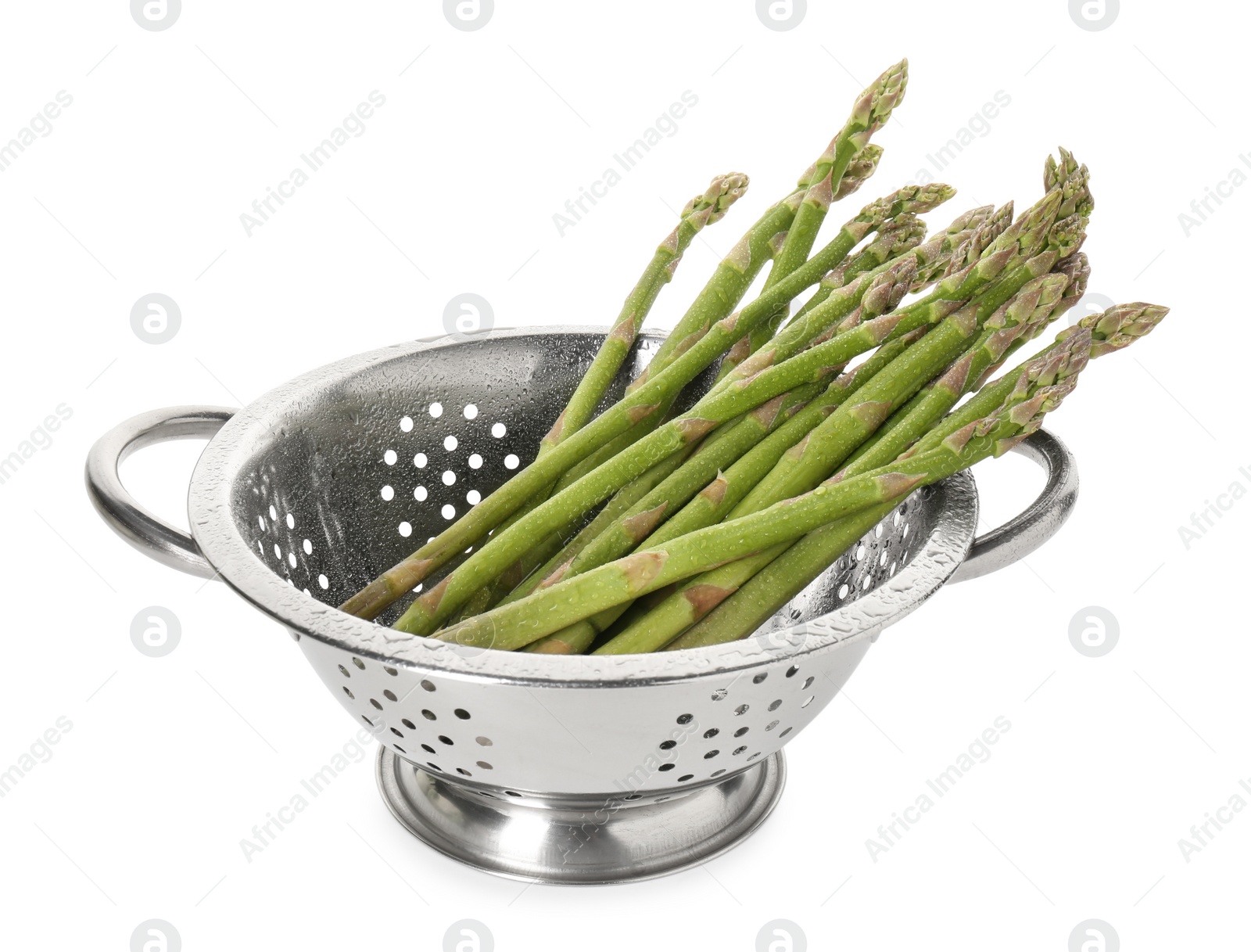 Photo of Metal colander with asparagus isolated on white