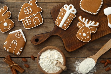 Photo of Flat lay composition with delicious homemade Christmas cookies on wooden table