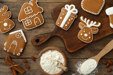 Flat lay composition with delicious homemade Christmas cookies on wooden table