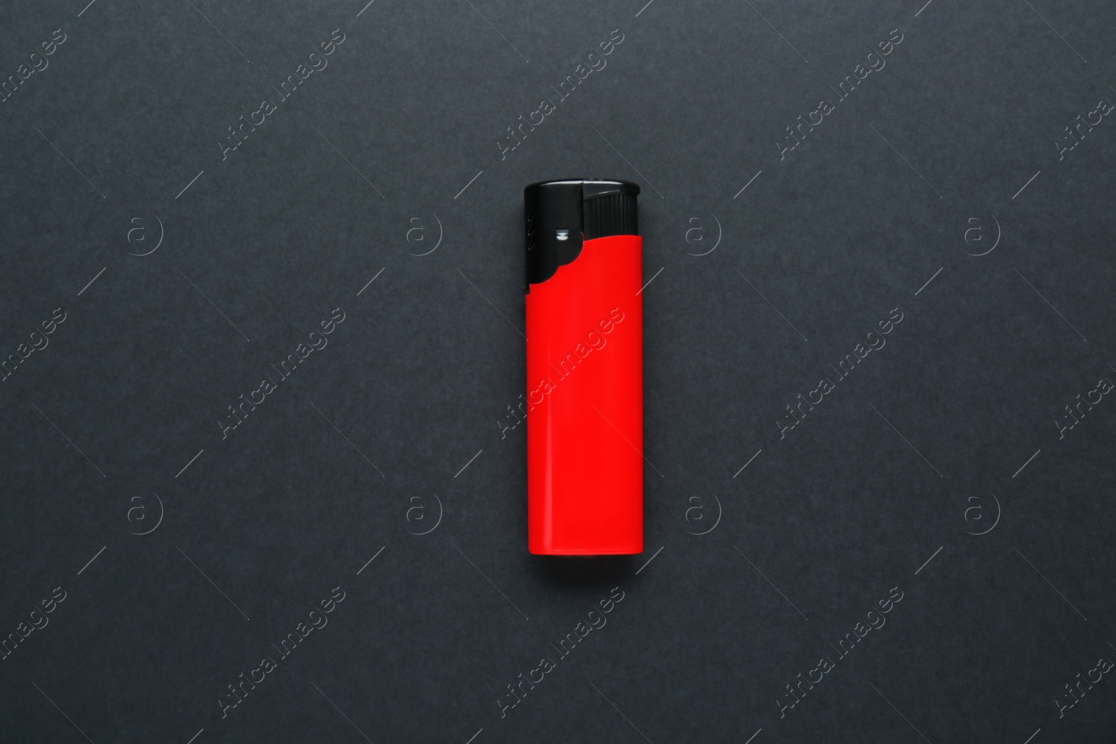 Photo of Stylish small pocket lighter on black background, top view