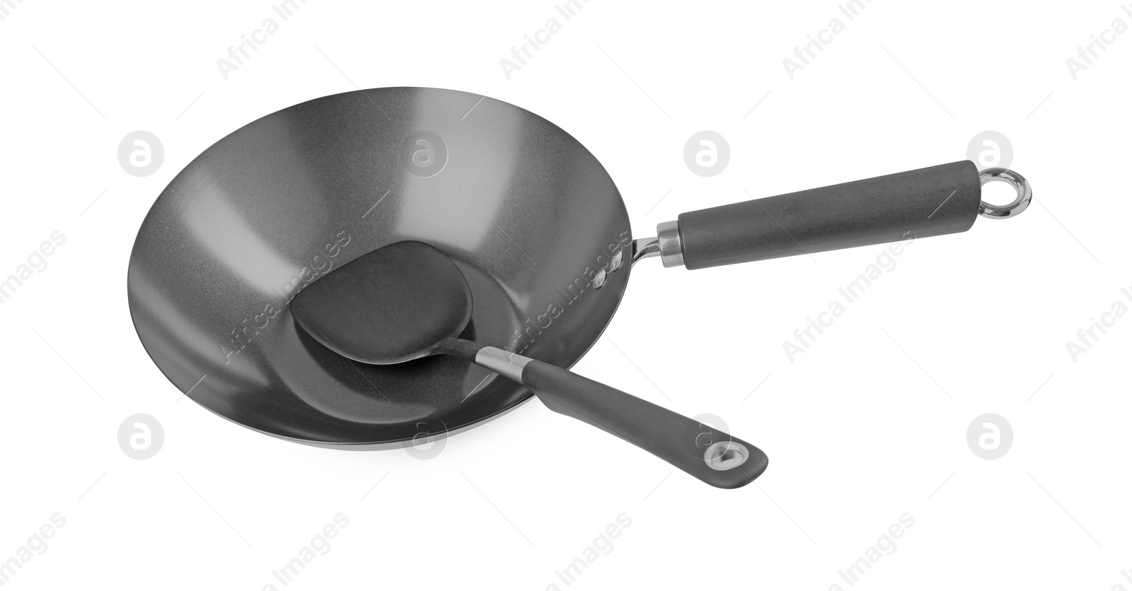 Photo of Metal wok and spatula isolated on white