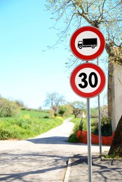 Road signs Maximum Speed 30 and No Truck on city street