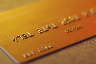 Photo of Plastic credit card on table, macro view