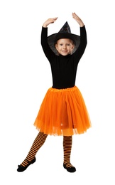 Photo of Cute little girl wearing Halloween costume on white background