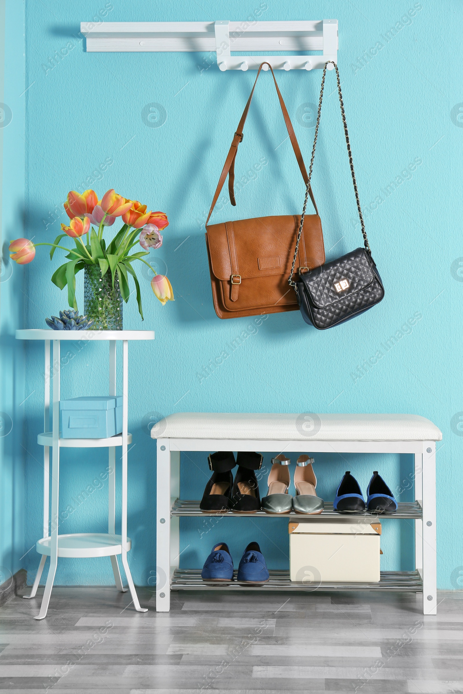 Photo of Storage bench with different female shoes indoors