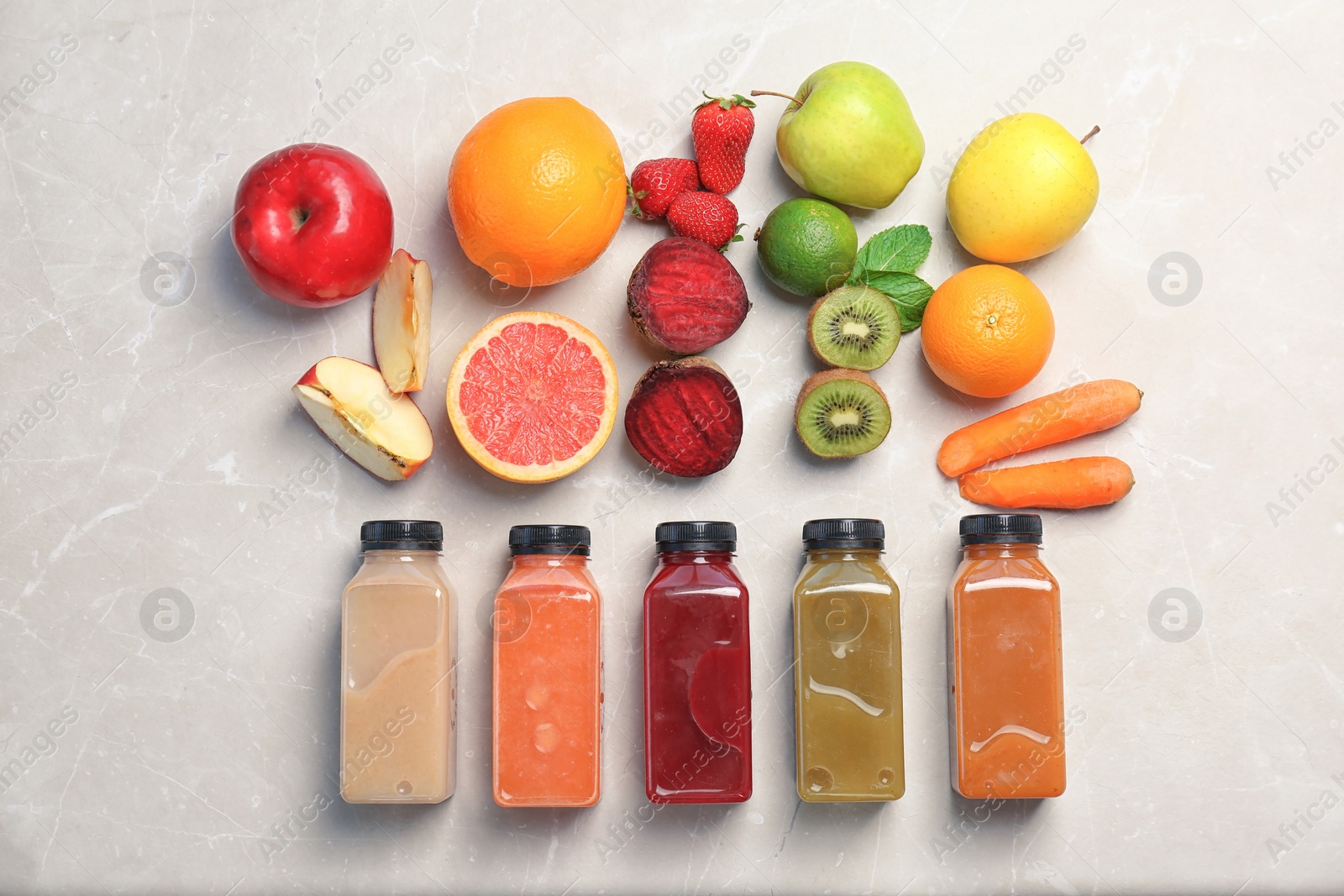 Photo of Flat lay composition with healthy detox smoothies and ingredients on light background