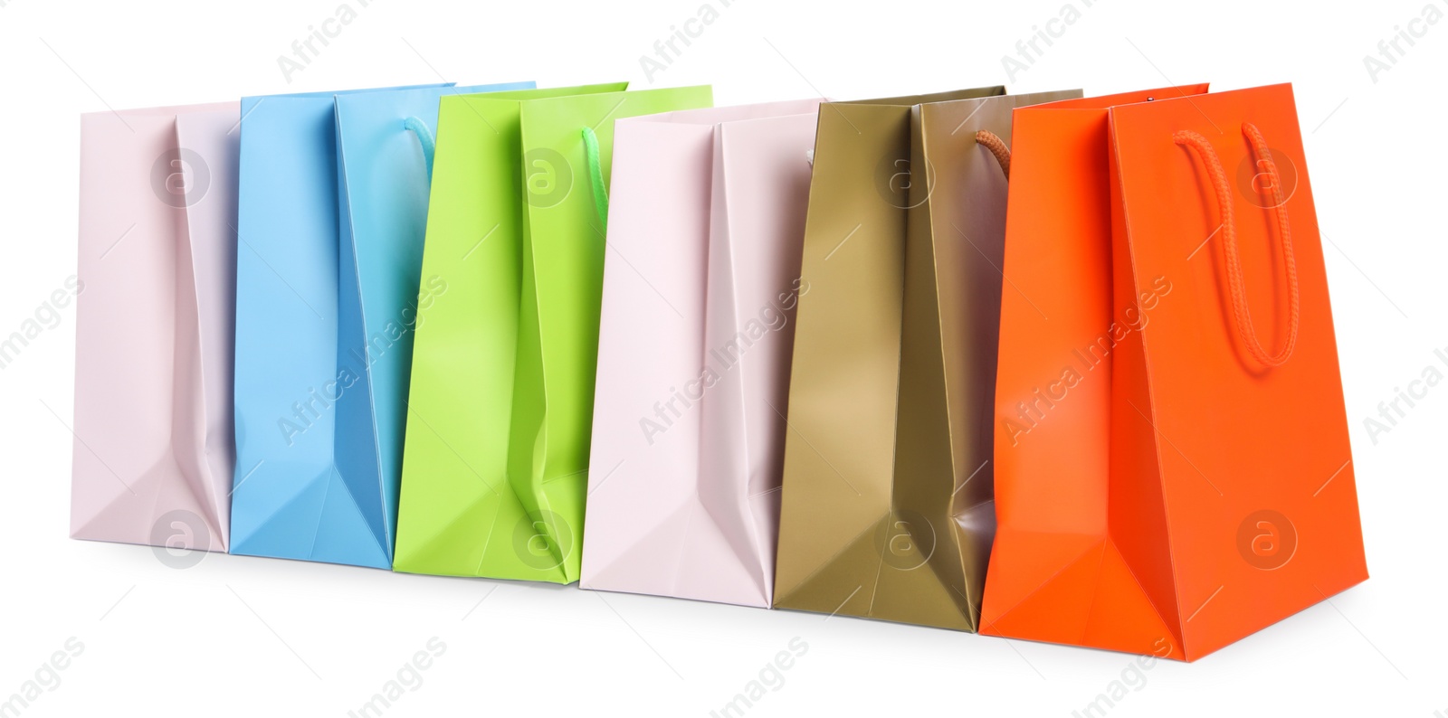 Photo of Colorful paper shopping bags isolated on white