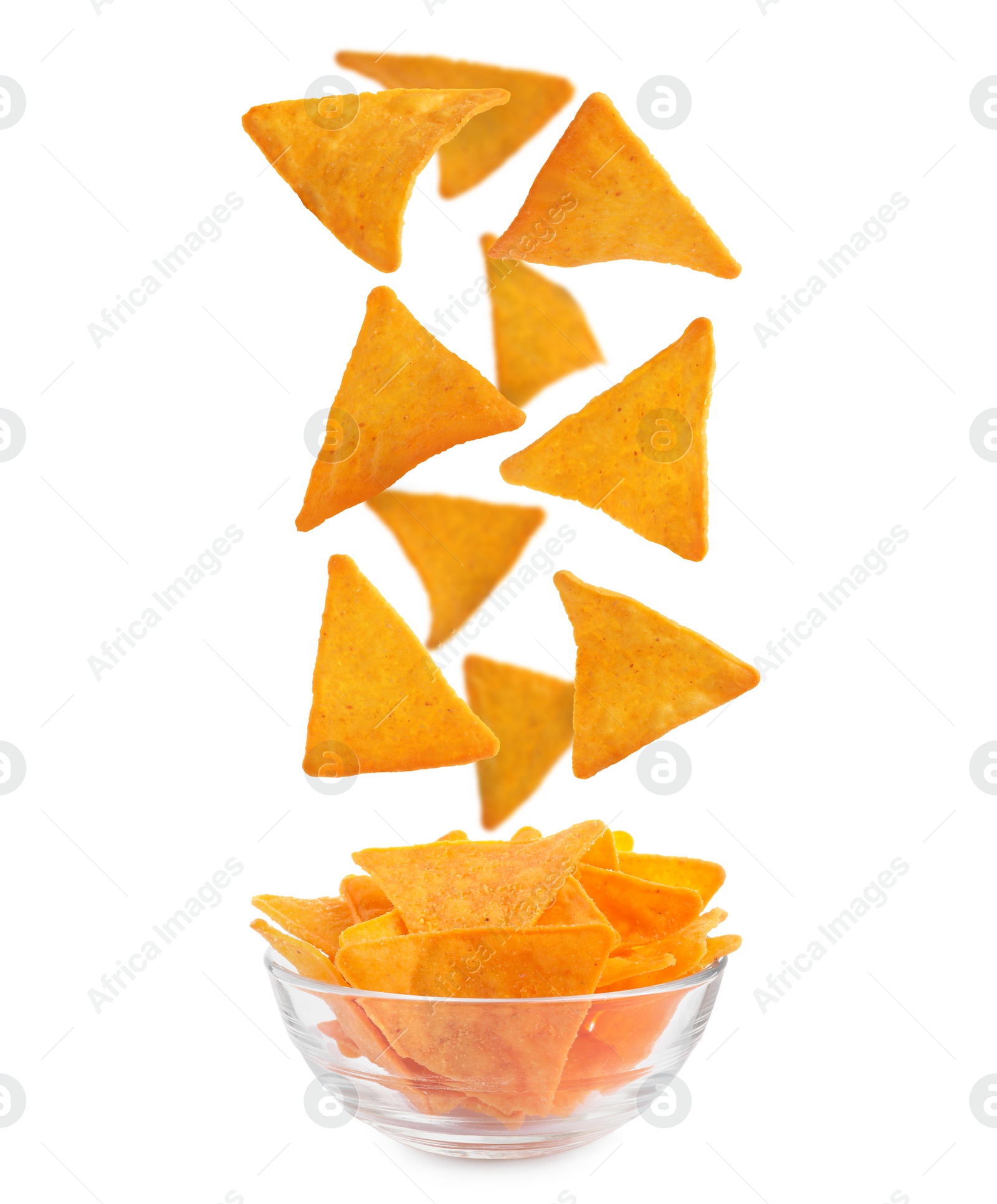 Image of Tasty tortilla chips (nachos) falling into bowl on white background