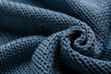 Beautiful pale blue knitted fabric as background, closeup