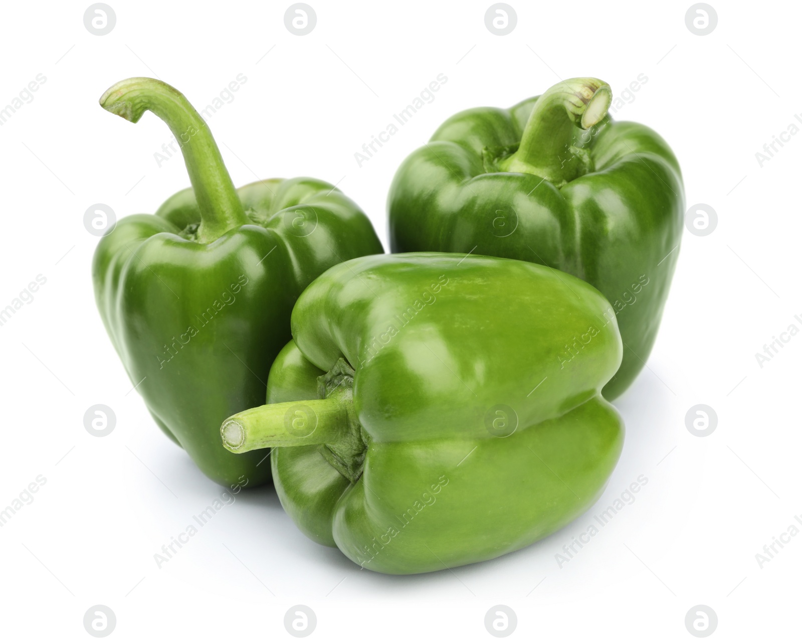 Photo of Ripe green bell peppers on white background