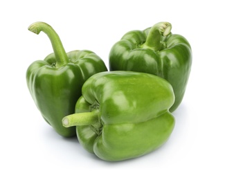 Ripe green bell peppers on white background