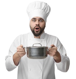 Photo of Surprised young chef in uniform holding cooking pot on white background