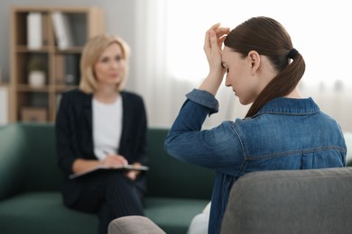 Professional psychotherapist working with patient in office