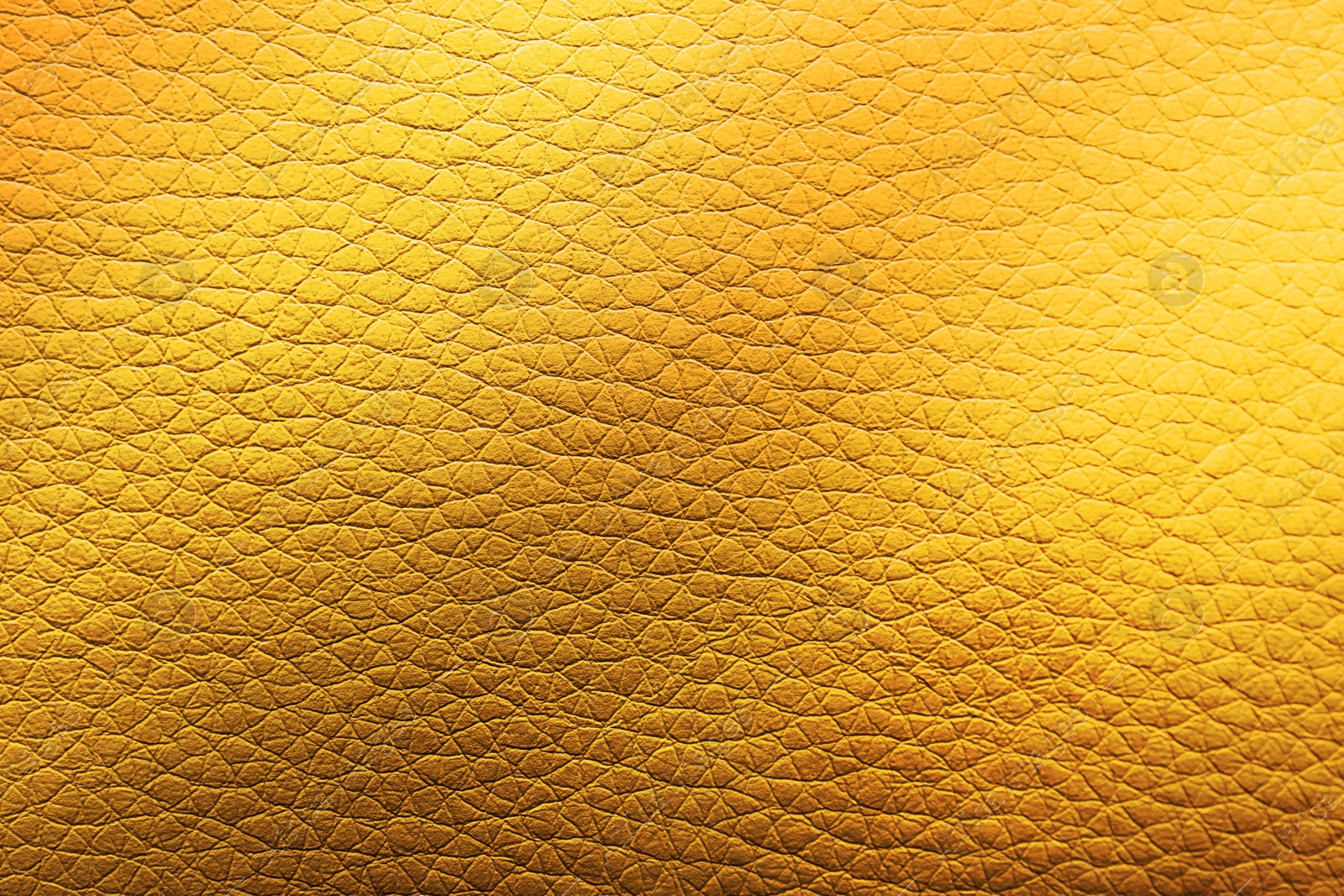 Image of Golden textured surface as background, closeup view