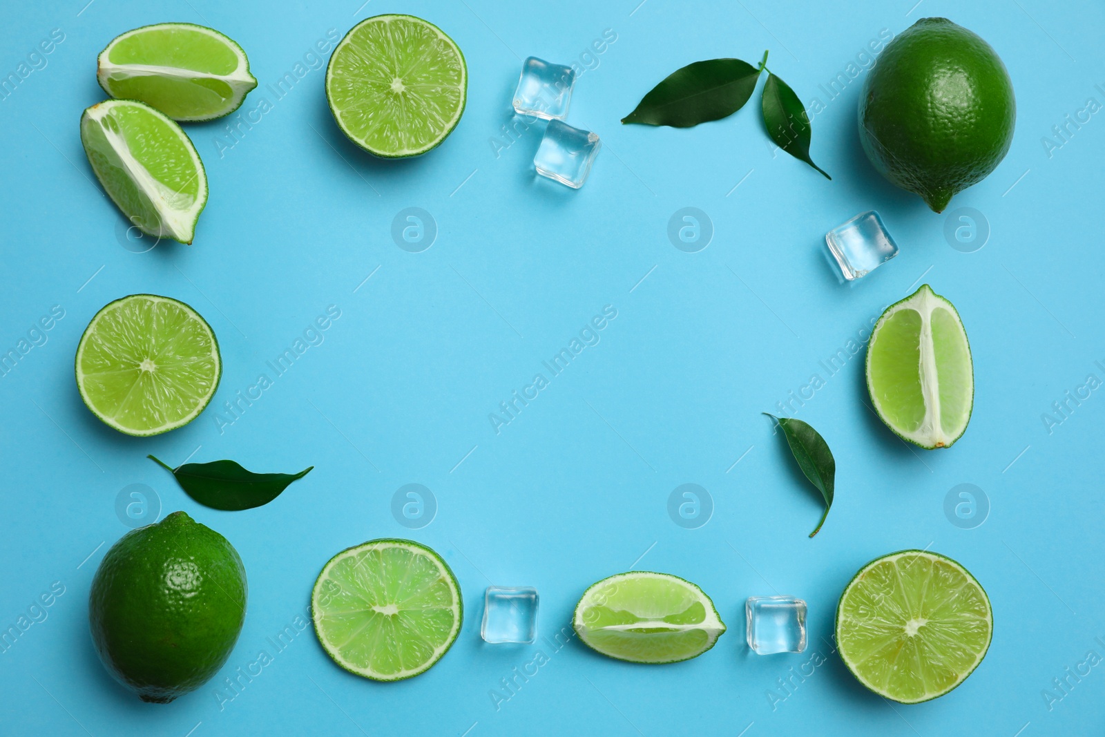 Photo of Flat lay composition with fresh juicy limes and ice cubes on light blue background. Space for text