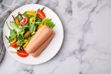 Photo of Delicious boiled sausages with salad on white marble table, top view. Space for text