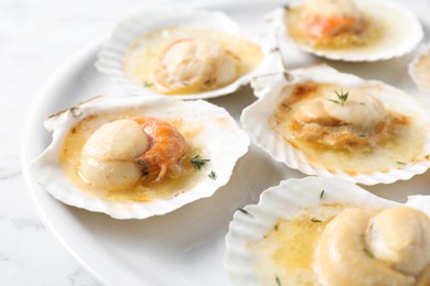 Photo of Fried scallops in shells on table, closeup