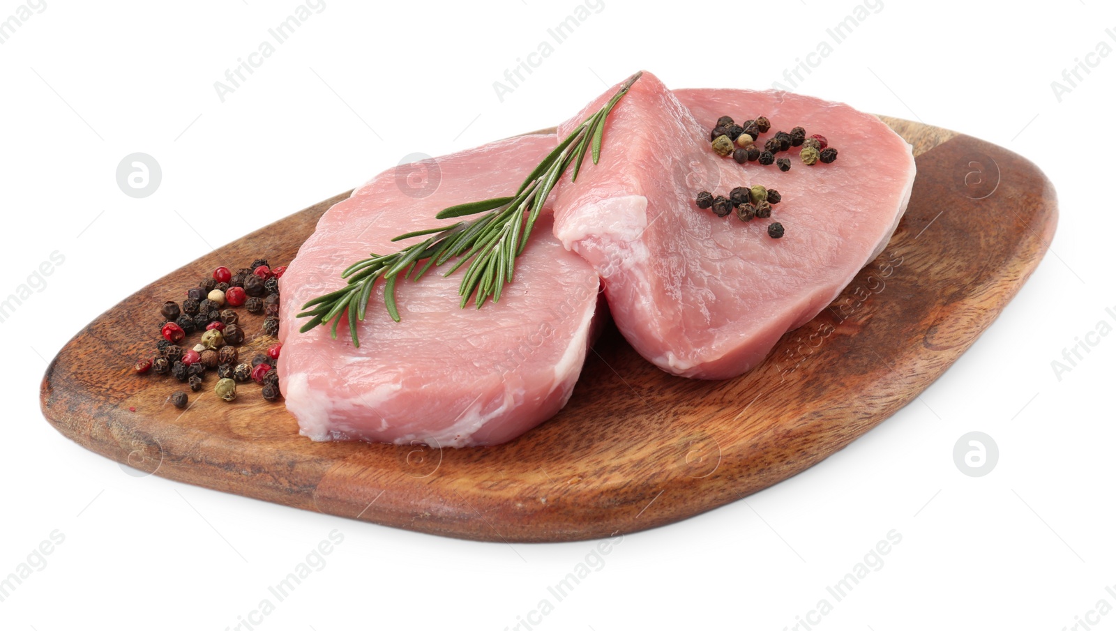 Photo of Wooden board with pieces of raw pork meat and spices isolated on white