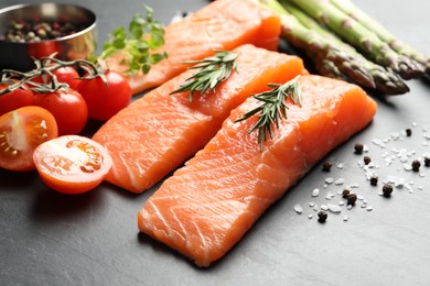Photo of Fresh raw salmon and ingredients for marinade on grey table