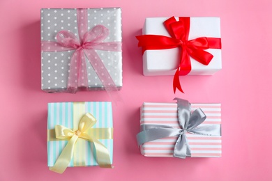 Different gift boxes on color background, flat lay