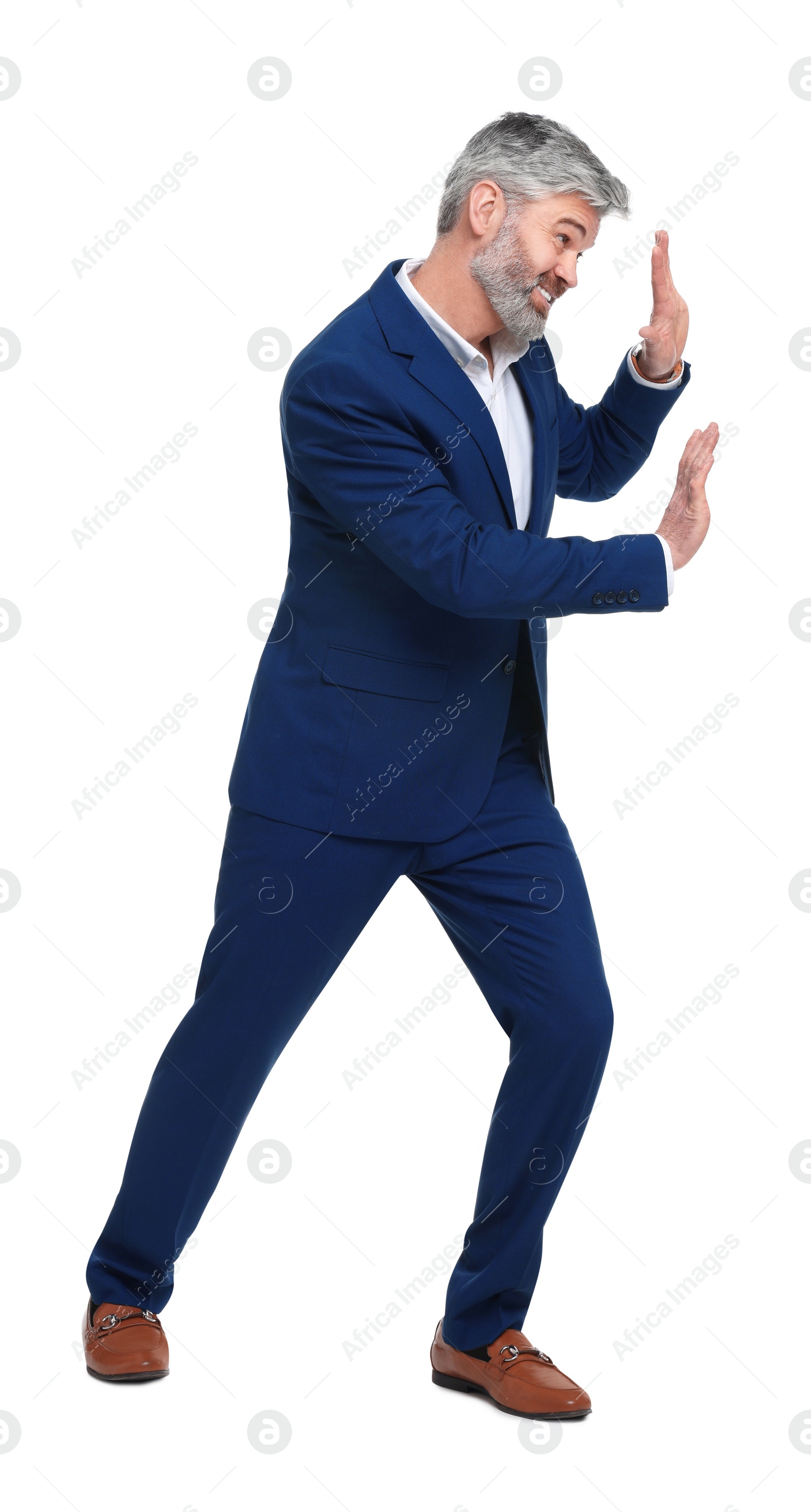 Photo of Mature businessman in stylish clothes posing on white background