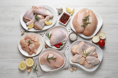 Flat lay composition with fresh raw chicken meat on white wooden table