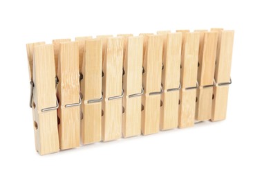 Photo of Set of wooden clothespins on white background