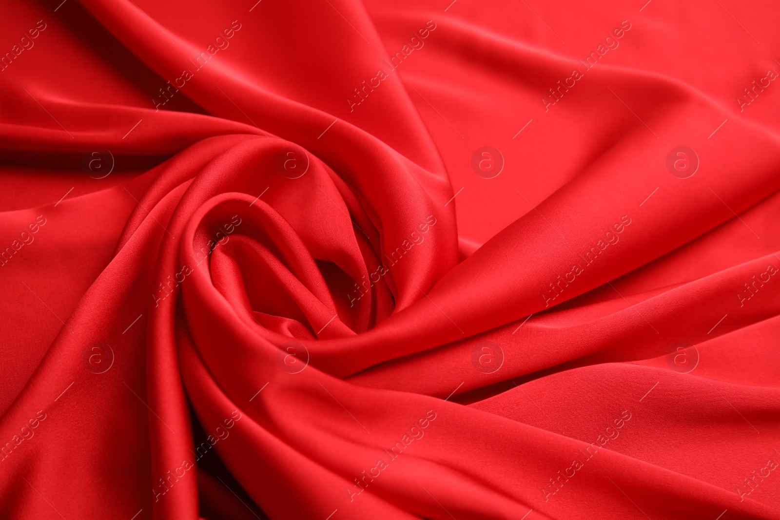 Photo of Texture of delicate red silk as background, closeup