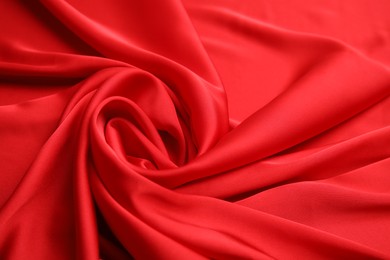 Texture of delicate red silk as background, closeup