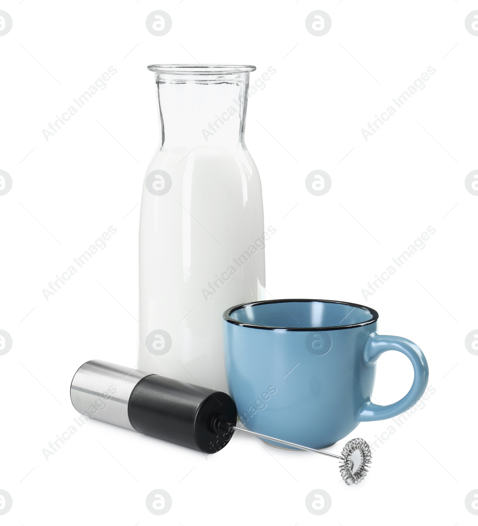 Photo of Milk frother wand, cup and glass carafe isolated on white