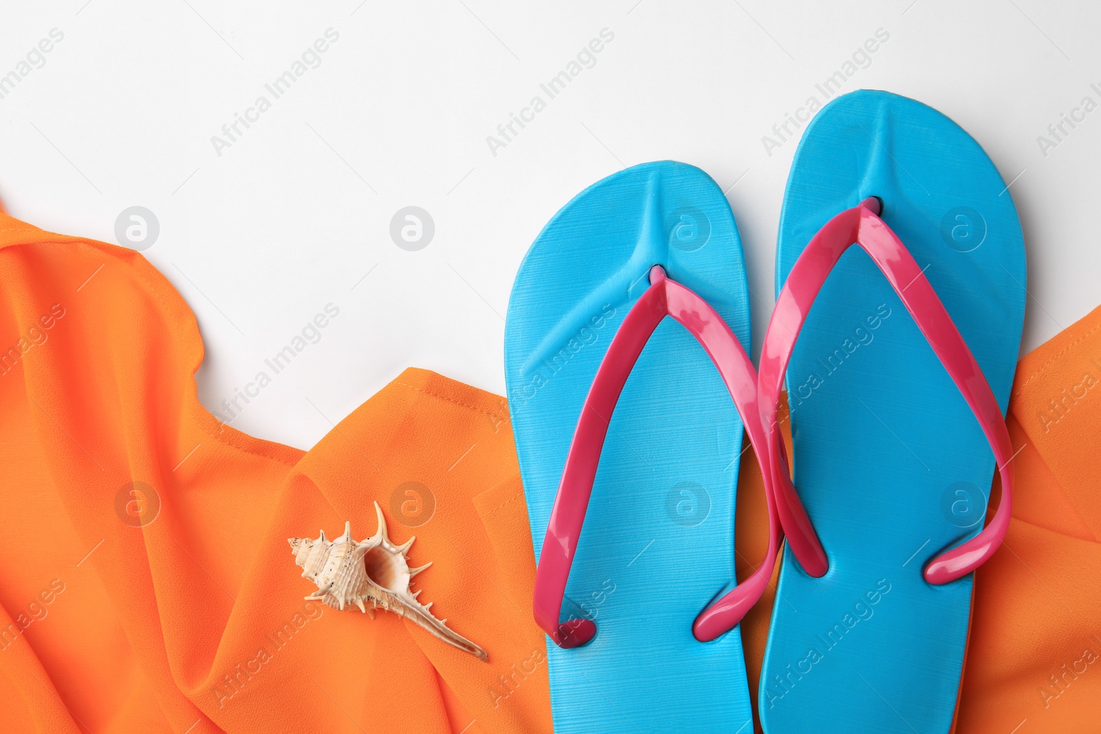 Photo of Flat lay composition with beach accessories on white background