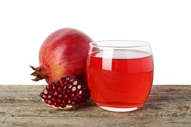 Photo of Refreshing pomegranate juice in glass and fruits on wooden table against white background