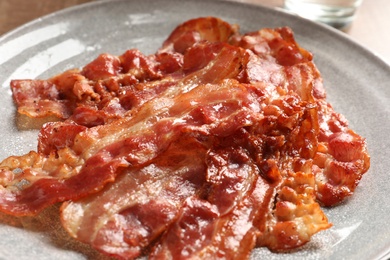 Plate with fried bacon, closeup