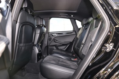 Inside of modern car with black leather seats