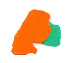 Photo of Orange and green paint samples on white background, top view