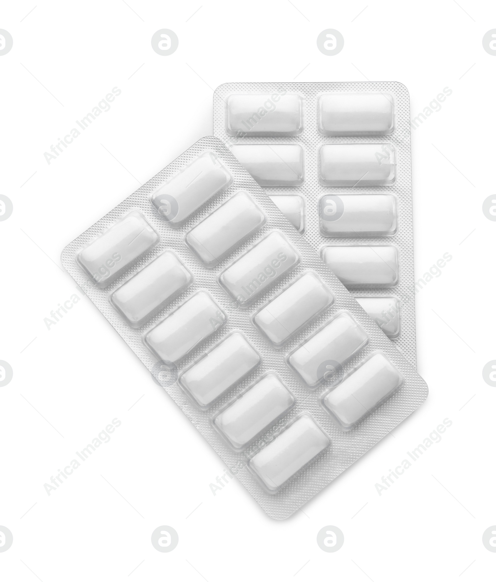 Photo of Blisters with chewing gums on white background, top view